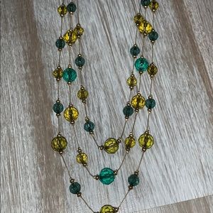 Multi strand green crystal and gold necklace